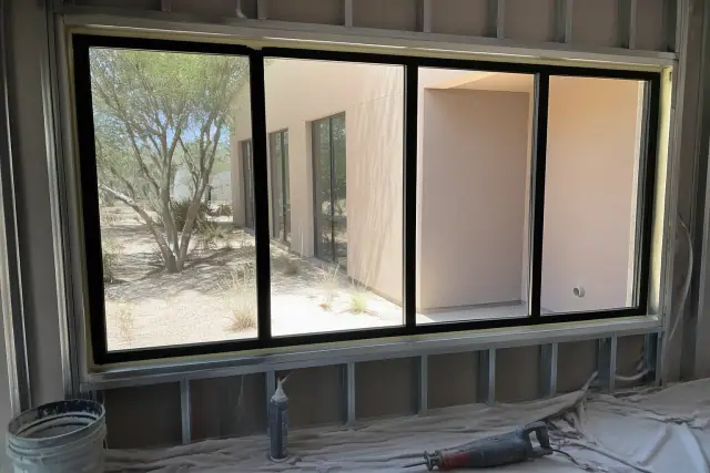 Thermally broken aluminum window frames installed in a commercial building construction site in Phoenix, AZ.