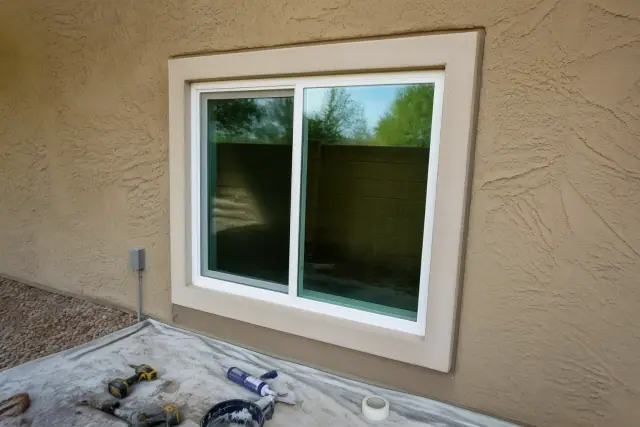 Vinyl slider window installed in a stucco wall at a jobsite in Phoenix, AZ.