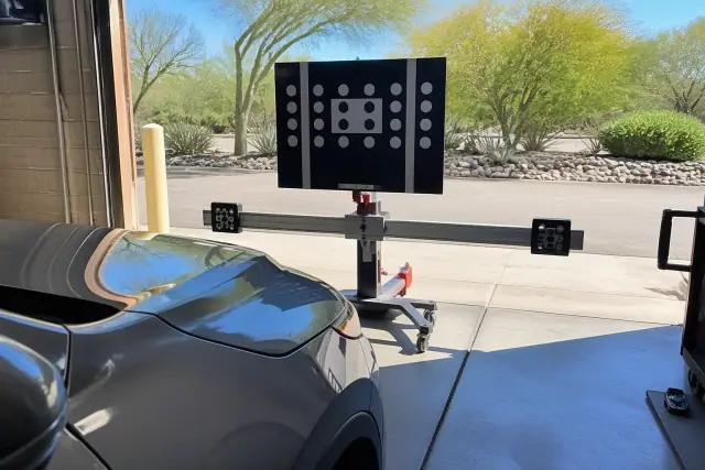ADAS calibration service being performed on a vehicle in a service bay in Scottsdale, AZ.