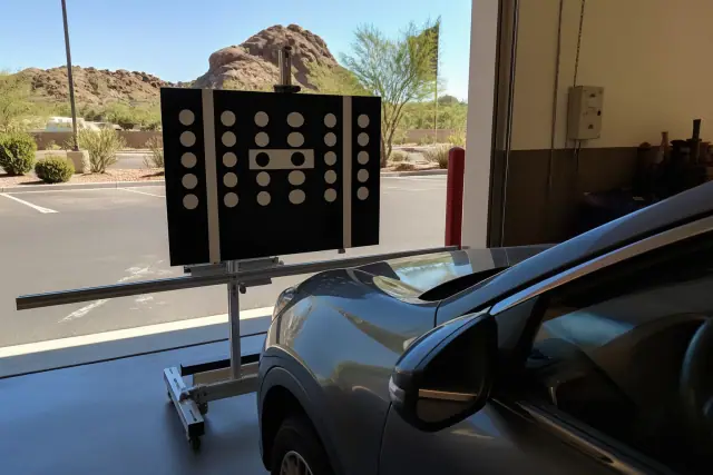ADAS camera calibration performed on a vehicle in an open service bay in Phoenix, AZ.