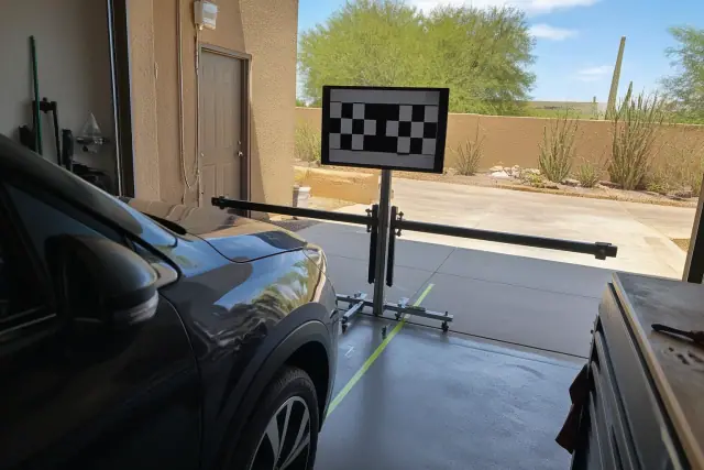 Digital calibration target stand set up for blind spot sensor calibration in a Phoenix, AZ service bay.