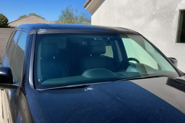 Newly installed windshield with retention tape on a vehicle in Avondale, AZ.