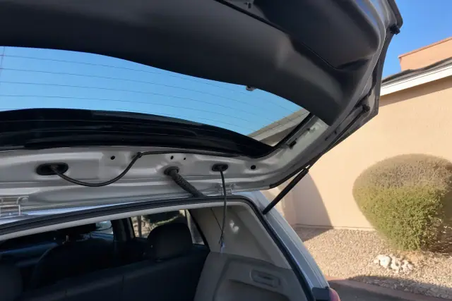New rear car glass with embedded wiring pigtails installed in a hatchback in Phoenix, AZ.