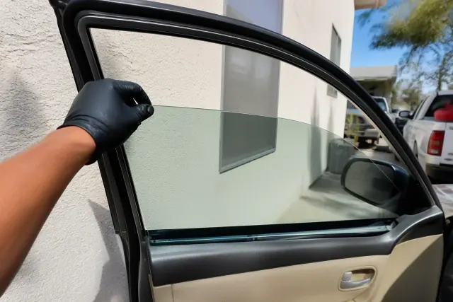 Side window and door glass replacement in a residential driveway in Phoenix, AZ.