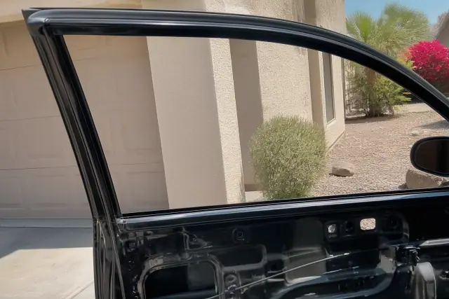 Side window replacement in progress on a vehicle door frame in Avondale, AZ.