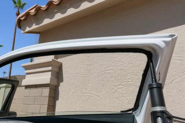 Technician preparing a vehicle door window channel for glass replacement in Phoenix, AZ.