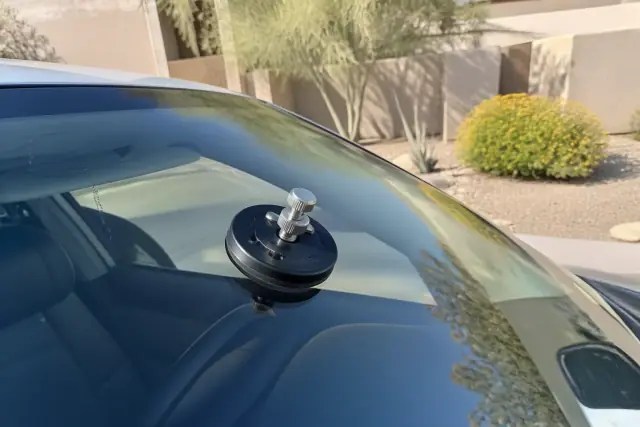 Resin injector tool repairing a windshield star break in Phoenix, AZ.