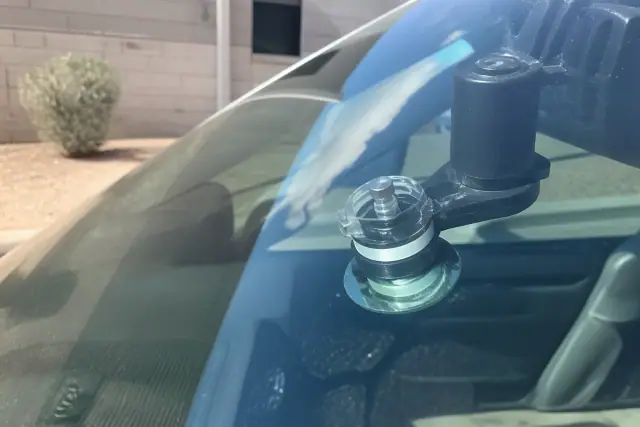 Resin injector tool repairing a windshield star break in Phoenix, AZ.