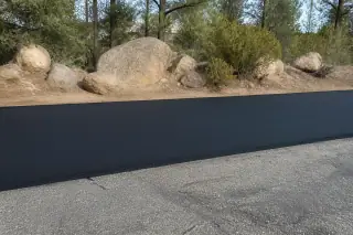 Smooth black hot mix asphalt transition between new and old pavement in Prescott, AZ.