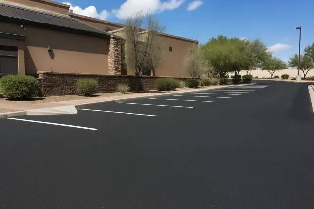 Newly resurfaced asphalt parking lot with fresh white parking lines at a restaurant in Scottsdale, AZ.