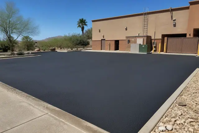 Newly paved asphalt parking lot behind a restaurant in Ahwatukee, AZ.