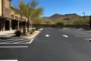 Freshly painted parking stalls and directional arrows on a retail asphalt lot in Scottsdale, AZ.