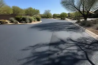 Fresh asphalt overlay with a textured finish on a residential street in Surprise, AZ.