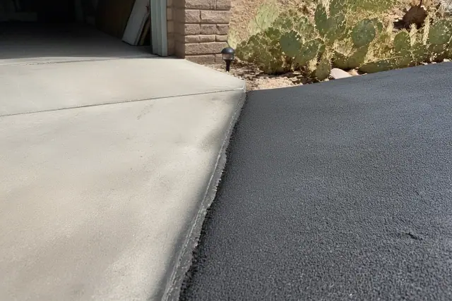 A 2-inch asphalt driveway transition at a residential home in Tempe, AZ with prickly pear cactus landscaping.