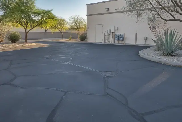 Freshly filled asphalt cracks at a commercial building in Tempe, AZ.