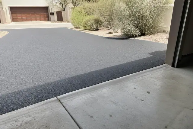 New asphalt driveway transition at a residential property in Paradise Valley, AZ.