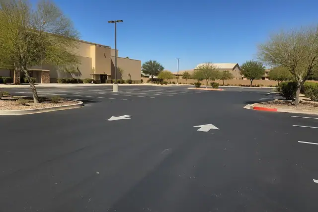 Newly paved asphalt parking lot at a retail shopping center in Gilbert, AZ.