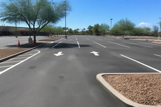 Newly painted parking lot lines and directional arrows at a retail center in Tempe, AZ.