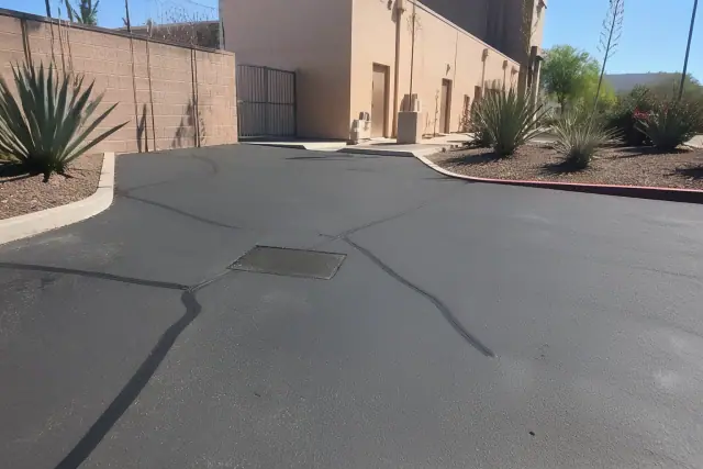 Asphalt crack filling and pothole repair at a commercial property in Tempe, AZ.