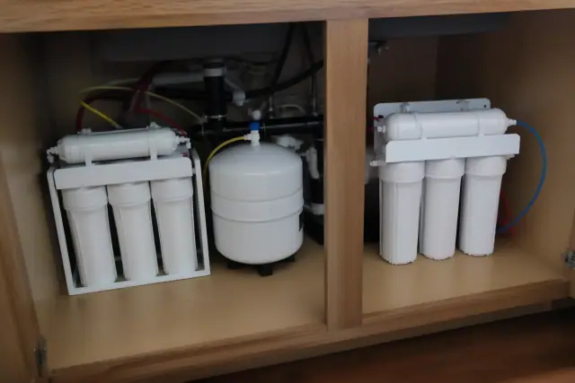 Reverse osmosis water filtration system installed under a kitchen sink in Tempe, AZ.