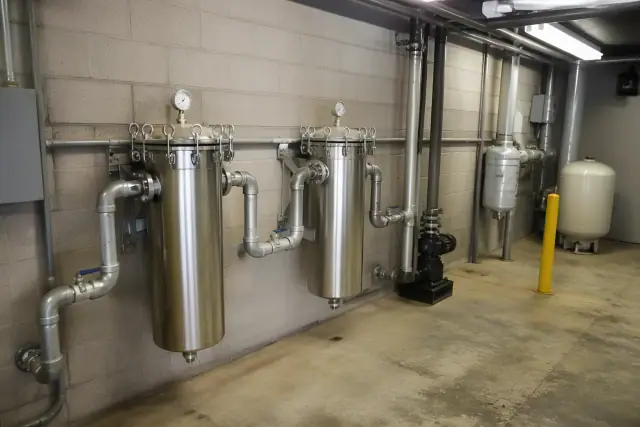 Industrial stainless steel bag sediment filters installed in a commercial mechanical room in Tempe, AZ.
