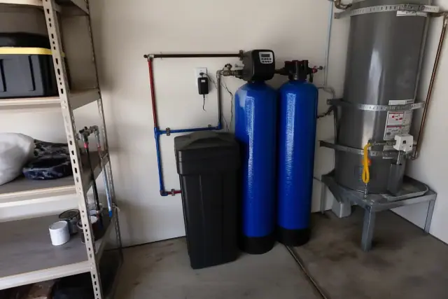 Water softener and carbon filtration system installed in a residential garage in Glendale, AZ.