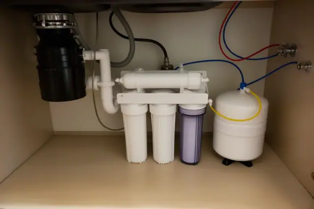 Reverse osmosis water filtration system installed under a laundry room sink in Tempe, AZ.
