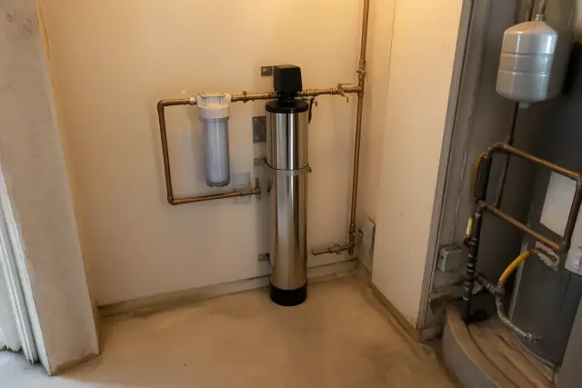 Stainless steel water filtration system with copper piping installed in a mechanical room in Scottsdale, AZ.