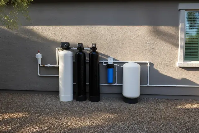 PFAS water filtration system installed against a stucco wall at a home in Peoria, AZ.