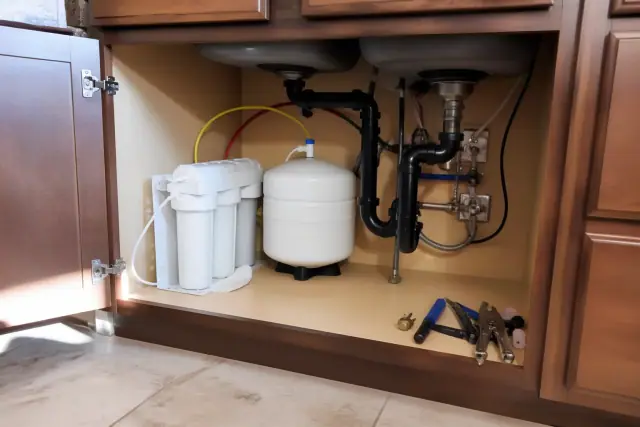 Reverse osmosis water filtration system installed under a kitchen sink in a Glendale, AZ home.