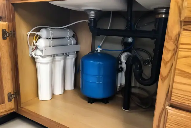 Reverse osmosis water filtration system installed under a kitchen sink in a Peoria, AZ home.