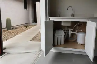 Completed reverse osmosis water filtration system installed under a sink in a Tempe, AZ home.