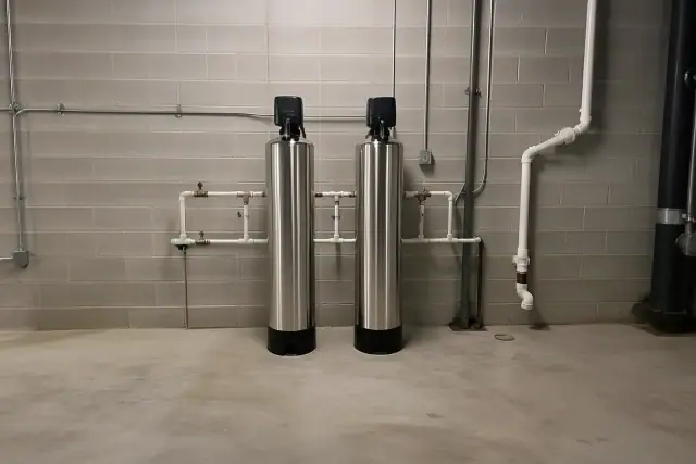 Salt-free water conditioner system with stainless steel tanks installed in a commercial mechanical room in Tempe, AZ.