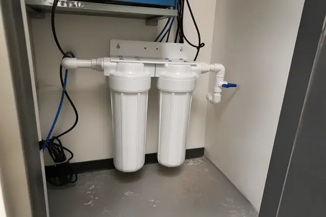 New sediment and carbon water filters installed in a utility closet in Tempe, AZ.