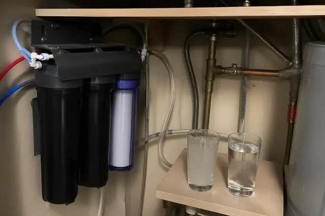 Reverse osmosis water filtration system installed in a utility closet in Tempe, AZ.
