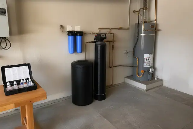 Water softener and filtration system with copper piping installed in a Tempe, AZ garage.