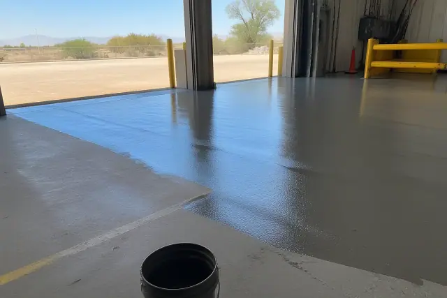 Freshly applied commercial epoxy flooring on a warehouse loading dock in Vail, AZ.