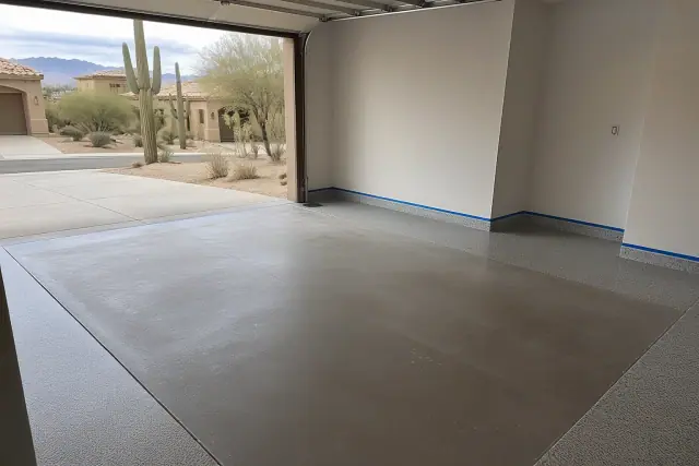 Concrete floor prepped for epoxy coating in a residential garage in Casas Adobes, AZ.