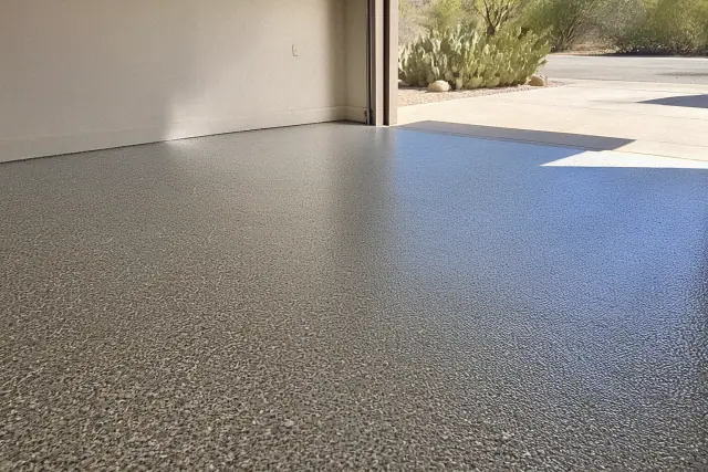 Concrete garage floor with a decorative flake finish in a residential garage in Tucson, AZ.
