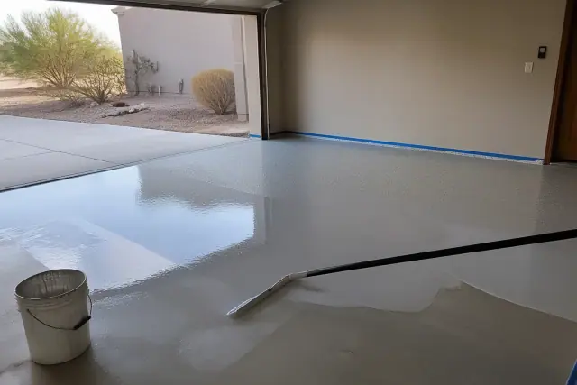 Epoxy floor coating being applied to a residential garage in Drexel Heights, AZ.