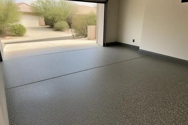 Concrete garage floor with flake finish in progress at a residential home in Catalina Foothills, AZ.