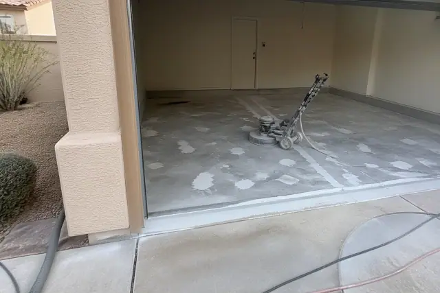 Concrete floor prepared for epoxy resurfacing in a residential garage in Drexel Heights, AZ.