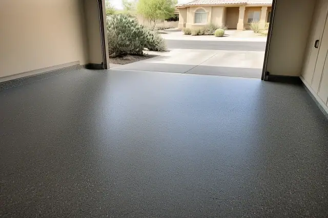 Concrete floor with decorative epoxy flakes inside a residential garage in Vail, AZ.