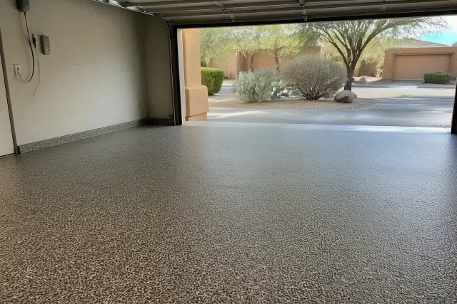 Multi-colored flake epoxy flooring in an empty two-car residential garage in Tucson, AZ.