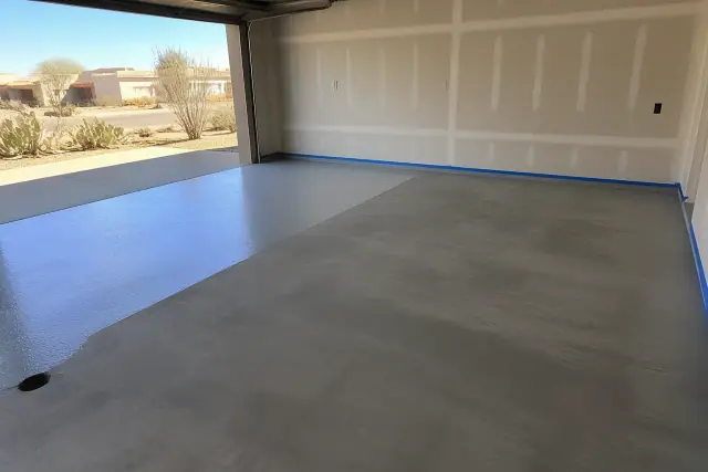 Concrete garage floor prepped for epoxy coating in a residential home in Drexel Heights, AZ.