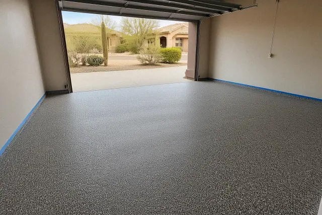 Two-car garage floor with decorative flake finish in progress at a home in Green Valley, AZ.