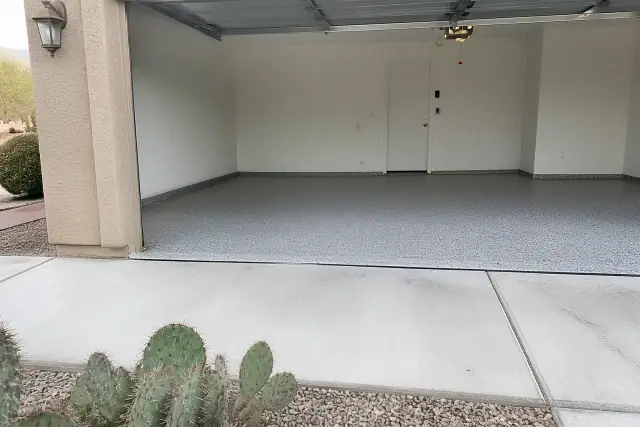Finished flake epoxy garage flooring with a desert landscape view in Tucson, AZ.