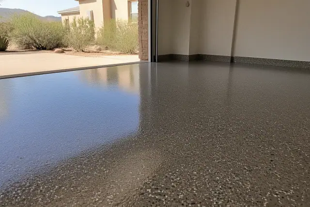 Freshly applied epoxy flooring with decorative flakes in a residential garage in Green Valley, AZ.