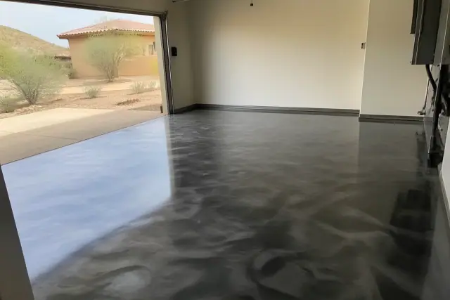 Metallic epoxy flooring with a swirling resin texture in a residential garage in Vail, AZ.