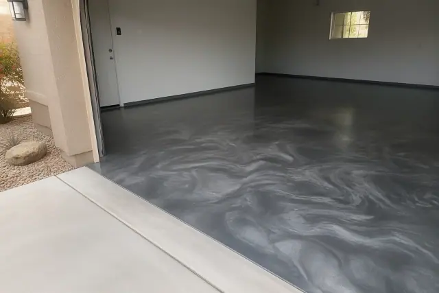 Metallic epoxy garage flooring with a marbled finish in a residential home in Casas Adobes, AZ.